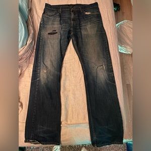 Banana republic blue jeans with patches on them